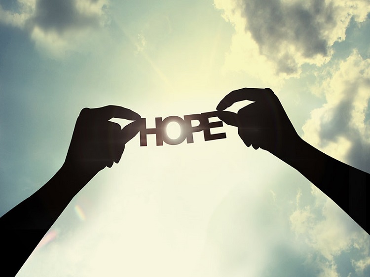 hopearmsraisedskycreditshutterstockcom